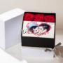 flower box personalizzato con rose stabilizzate e foto su tela